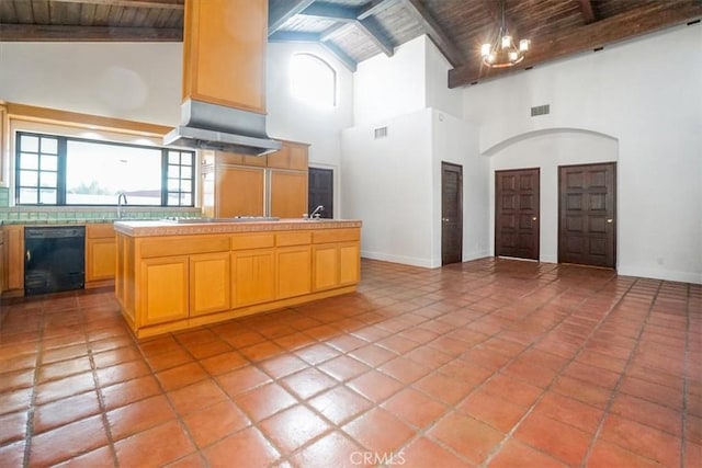 kitchen featuring a healthy amount of sunlight, dishwasher, and wooden ceiling