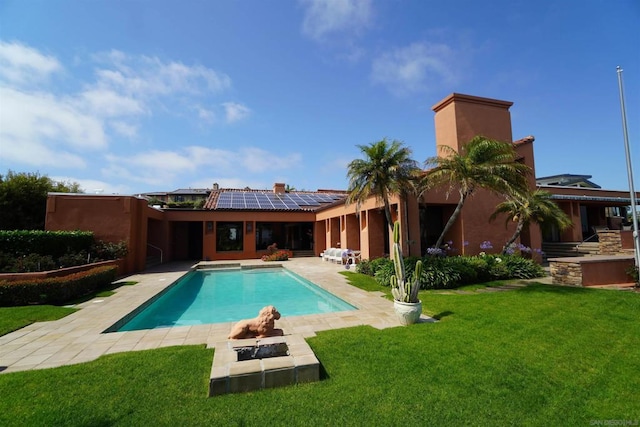 view of pool featuring a lawn and a patio area