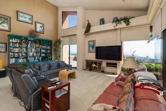 carpeted living room featuring high vaulted ceiling