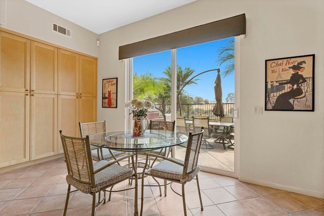 dining area with light tile patterned floors