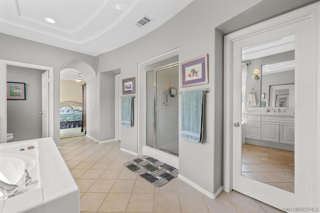 bathroom featuring tile patterned floors, vanity, and walk in shower