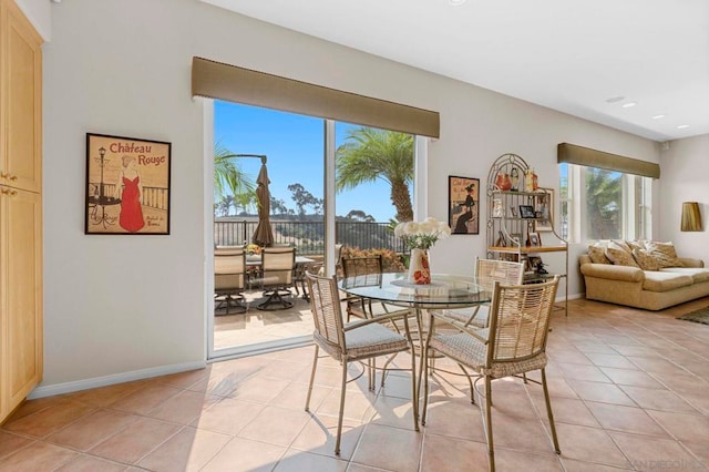 dining area with light tile patterned floors