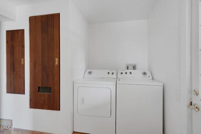 washroom with washing machine and clothes dryer