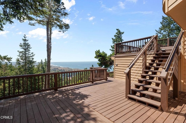 wooden deck with a water view