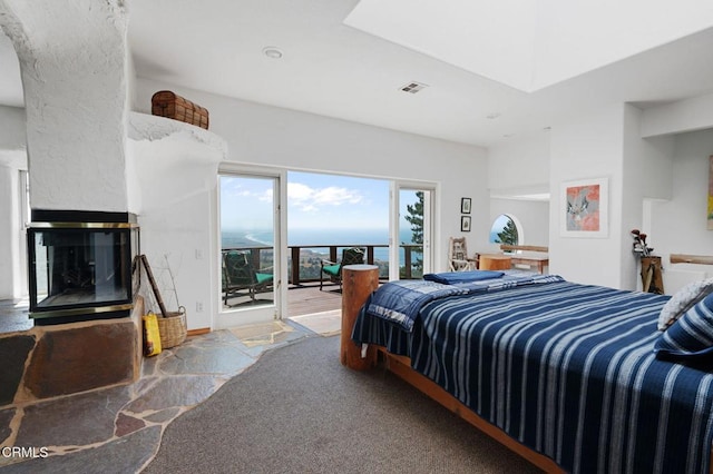 carpeted bedroom featuring access to outside