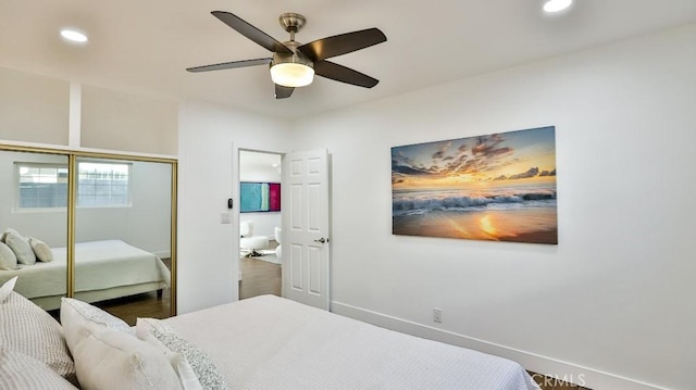 bedroom featuring ceiling fan and a closet