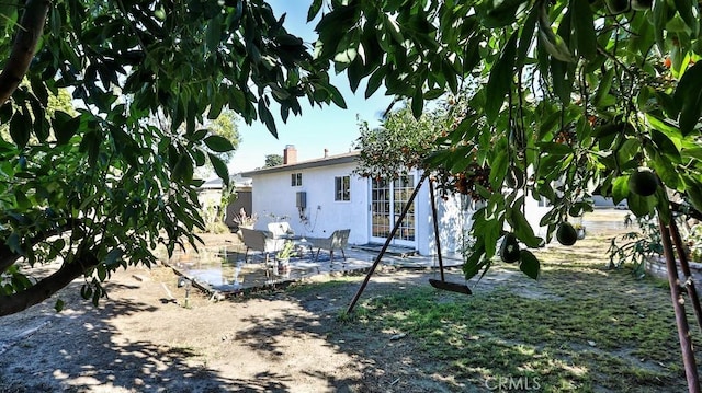 rear view of property with a patio