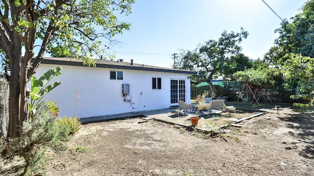 rear view of house with a patio