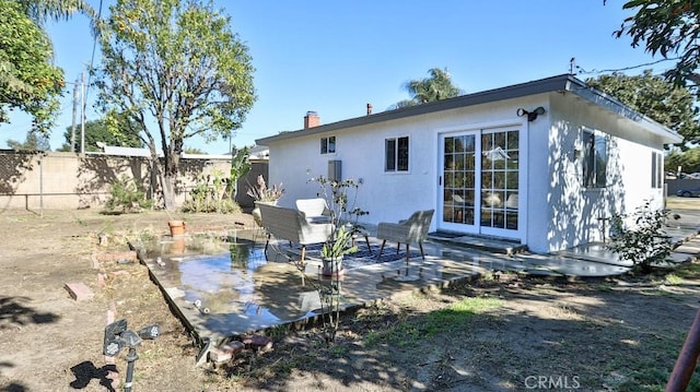 rear view of property with a patio