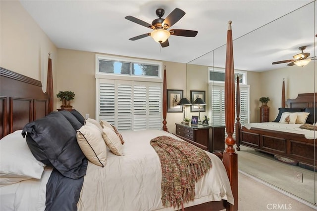 bedroom featuring light colored carpet and ceiling fan