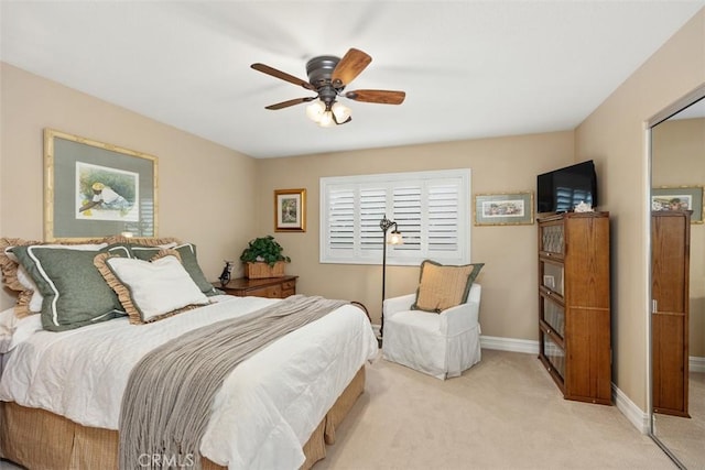 carpeted bedroom featuring ceiling fan