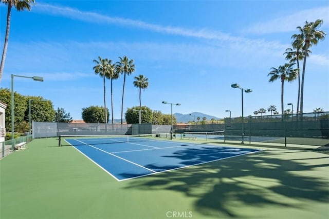 view of sport court with a mountain view