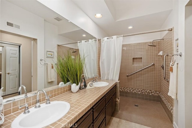 bathroom with tile patterned flooring, vanity, and a shower with shower curtain