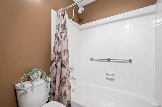 bathroom with toilet and shower / bathtub combination with curtain