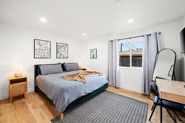 bedroom with light hardwood / wood-style floors