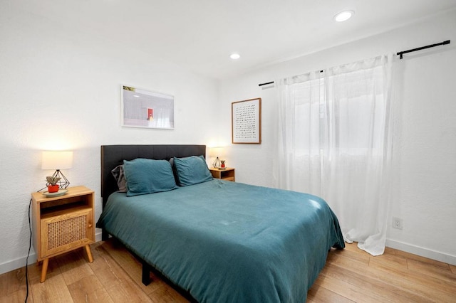 bedroom with light hardwood / wood-style floors