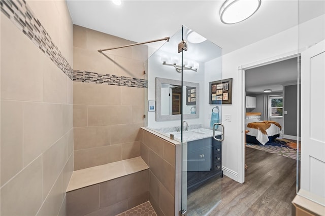 41026 Los Amantes Rd, Temecula, CA 92592 - bathroom featuring a shower stall, wood finished floors, ensuite bathroom, a chandelier, and vanity