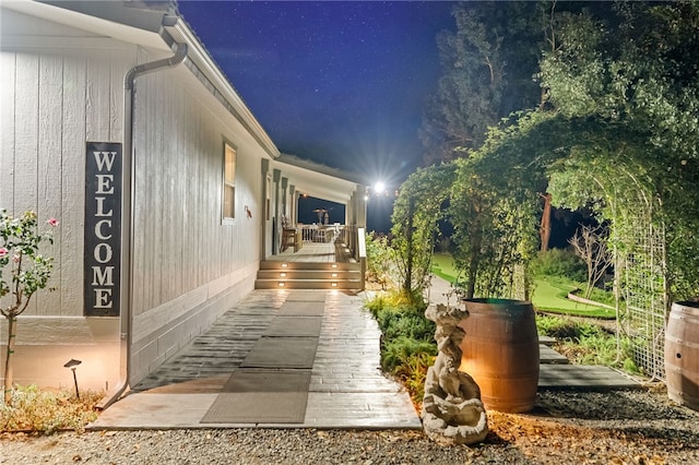 41026 Los Amantes Rd, Temecula, CA 92592 - property exterior at twilight featuring covered porch