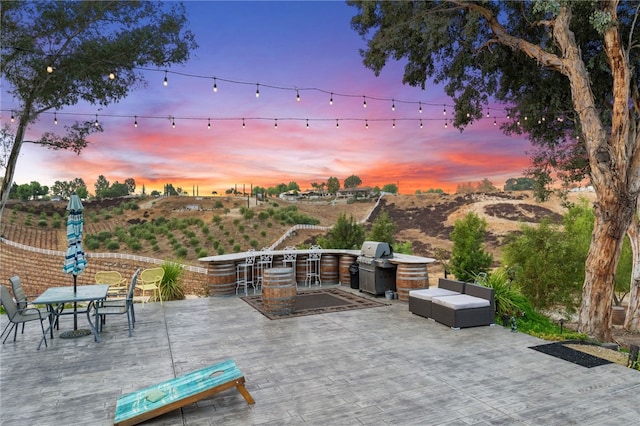 41026 Los Amantes Rd, Temecula, CA 92592 - view of patio / terrace featuring exterior kitchen and outdoor dining space