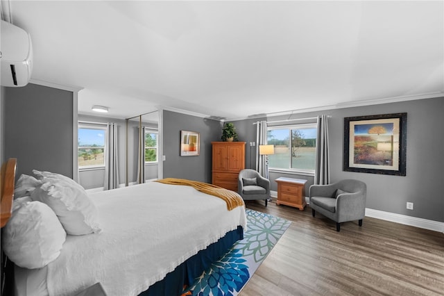 41026 Los Amantes Rd, Temecula, CA 92592 - bedroom featuring a wall mounted air conditioner, crown molding, wood finished floors, and multiple windows
