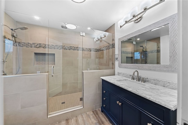 41026 Los Amantes Rd, Temecula, CA 92592 - bathroom featuring a shower stall, vanity, and wood finished floors