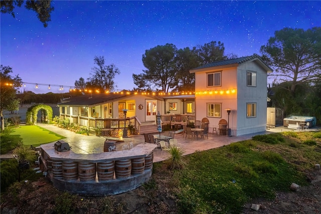 41026 Los Amantes Rd, Temecula, CA 92592 - rear view of property with a jacuzzi, a patio area, and a wooden deck