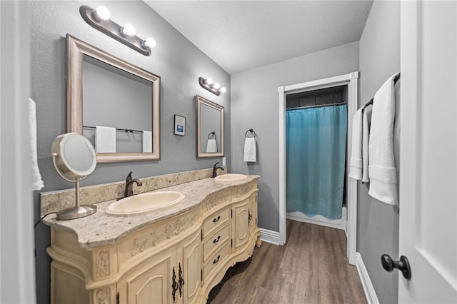 41026 Los Amantes Rd, Temecula, CA 92592 - full bathroom featuring double vanity and wood finished floors