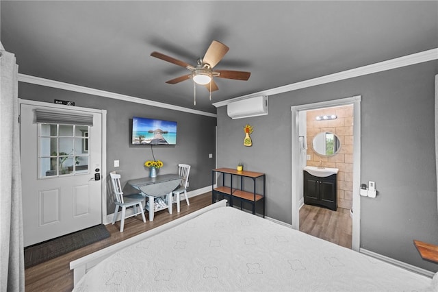 41026 Los Amantes Rd, Temecula, CA 92592 - bedroom featuring a wall unit AC, wood finished floors, ornamental molding, ceiling fan, and ensuite bathroom