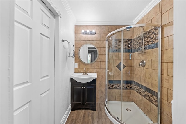 41026 Los Amantes Rd, Temecula, CA 92592 - full bath featuring crown molding, vanity, a stall shower, wood finished floors, and tile walls