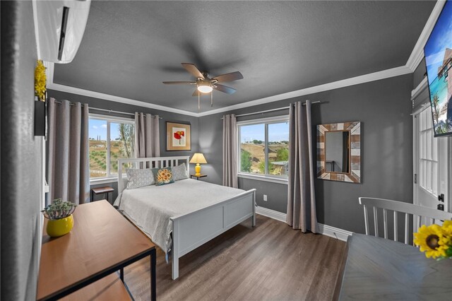 41026 Los Amantes Rd, Temecula, CA 92592 - bedroom featuring multiple windows, wood finished floors, ornamental molding, a textured ceiling, and ceiling fan