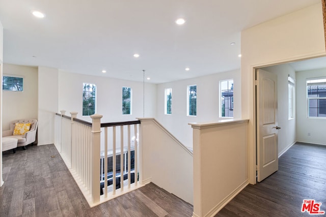 hall with dark hardwood / wood-style floors