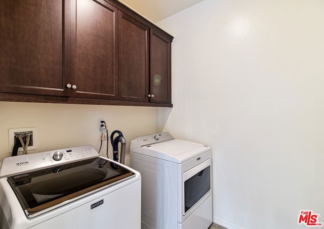 laundry area with cabinets and washer and dryer