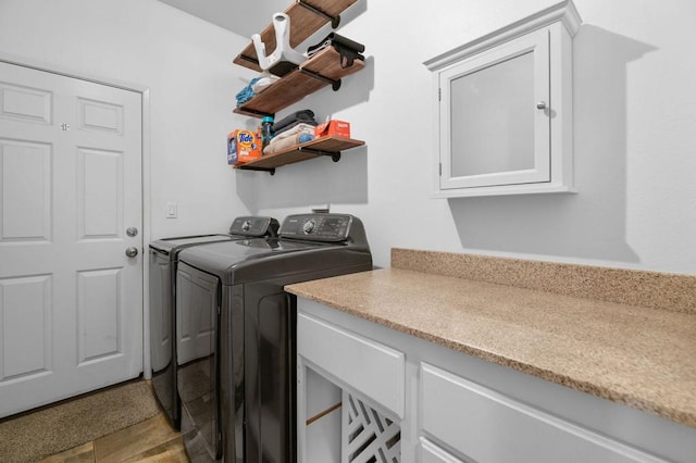 clothes washing area featuring washing machine and dryer