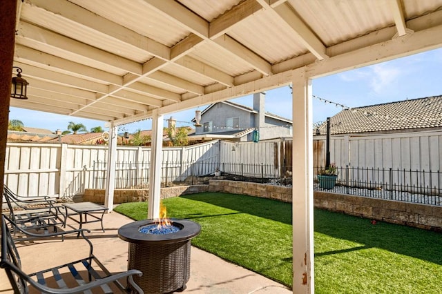 view of patio / terrace featuring an outdoor fire pit