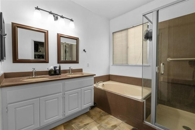 bathroom with vanity and separate shower and tub