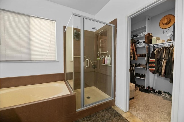 bathroom with tile patterned flooring and plus walk in shower