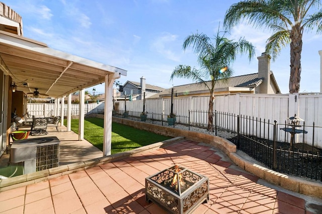 view of patio / terrace with central AC unit, ceiling fan, and an outdoor fire pit