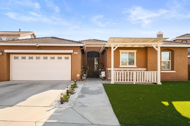 view of front facade with a garage and a front yard