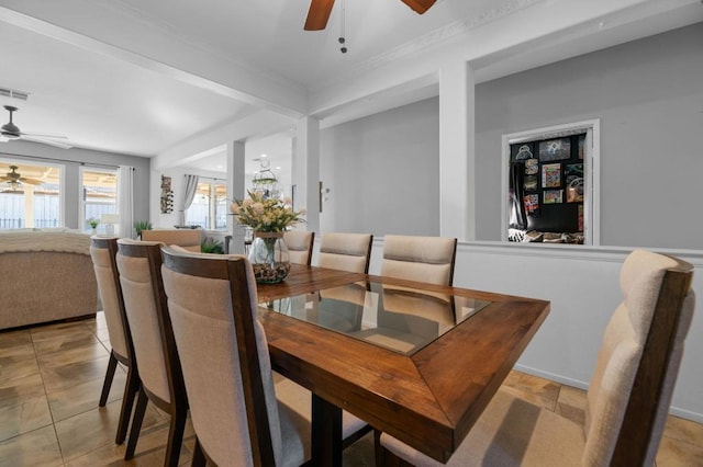 dining area with ceiling fan and light tile patterned flooring