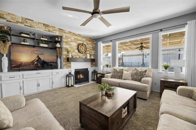 carpeted living room featuring ceiling fan