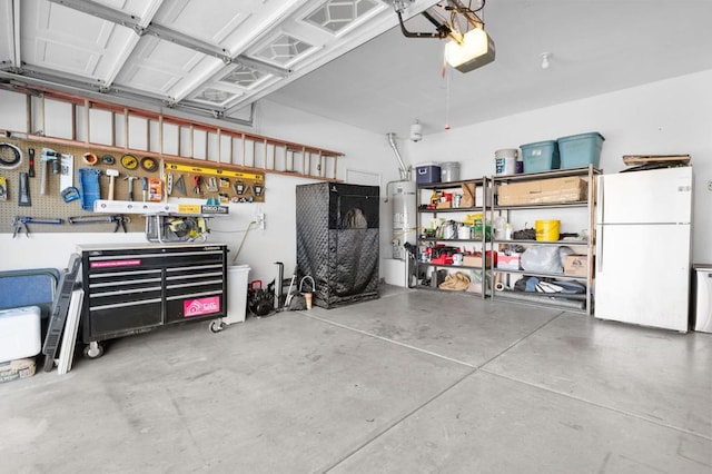 garage featuring a workshop area, white fridge, and a garage door opener