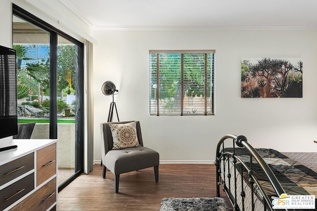 bedroom with crown molding and hardwood / wood-style floors