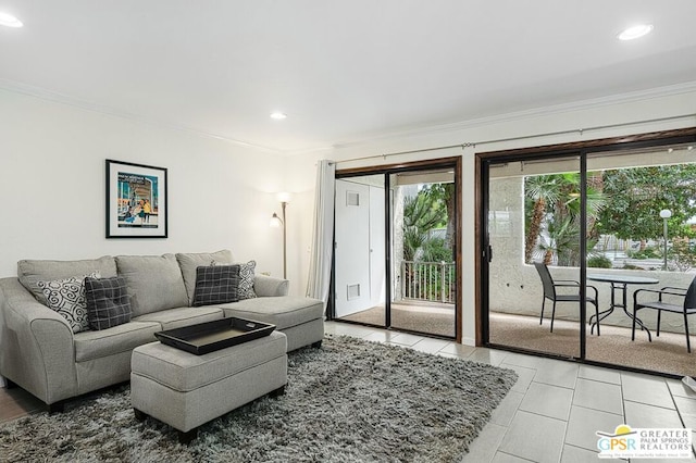 living room with crown molding and light tile patterned flooring