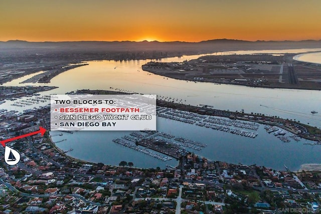 aerial view at dusk with a water view