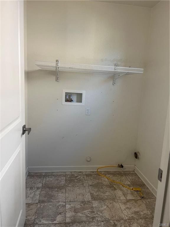 laundry room with hookup for a gas dryer and hookup for a washing machine