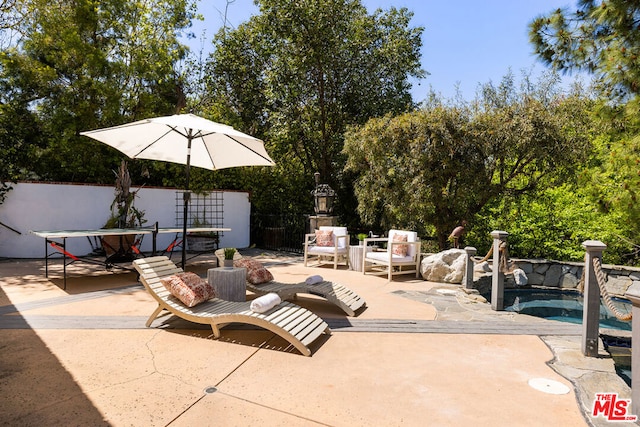 view of patio / terrace featuring a hot tub