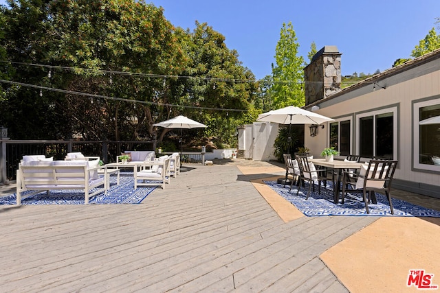 wooden deck with an outdoor hangout area