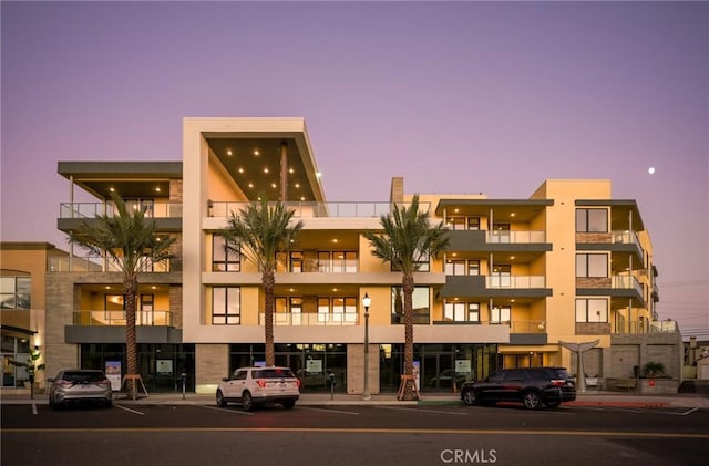 view of outdoor building at dusk