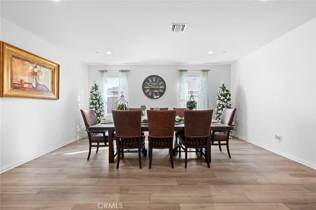 dining room featuring plenty of natural light and light hardwood / wood-style floors