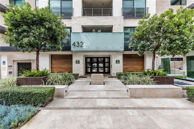 property entrance featuring french doors